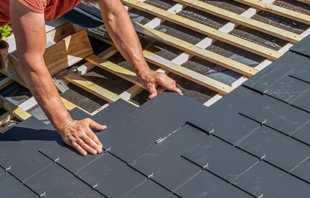 Natural slate roof being installed